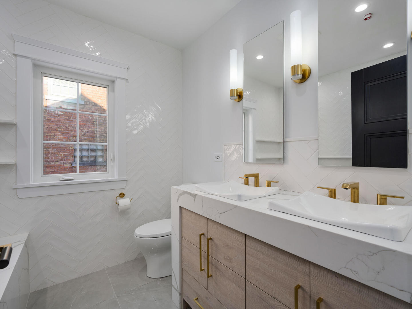 1115 South Delphia Avenue Park Ridge, IL 60068 - Photo 20 of 38 a bathroom with a toilet sink and mirror