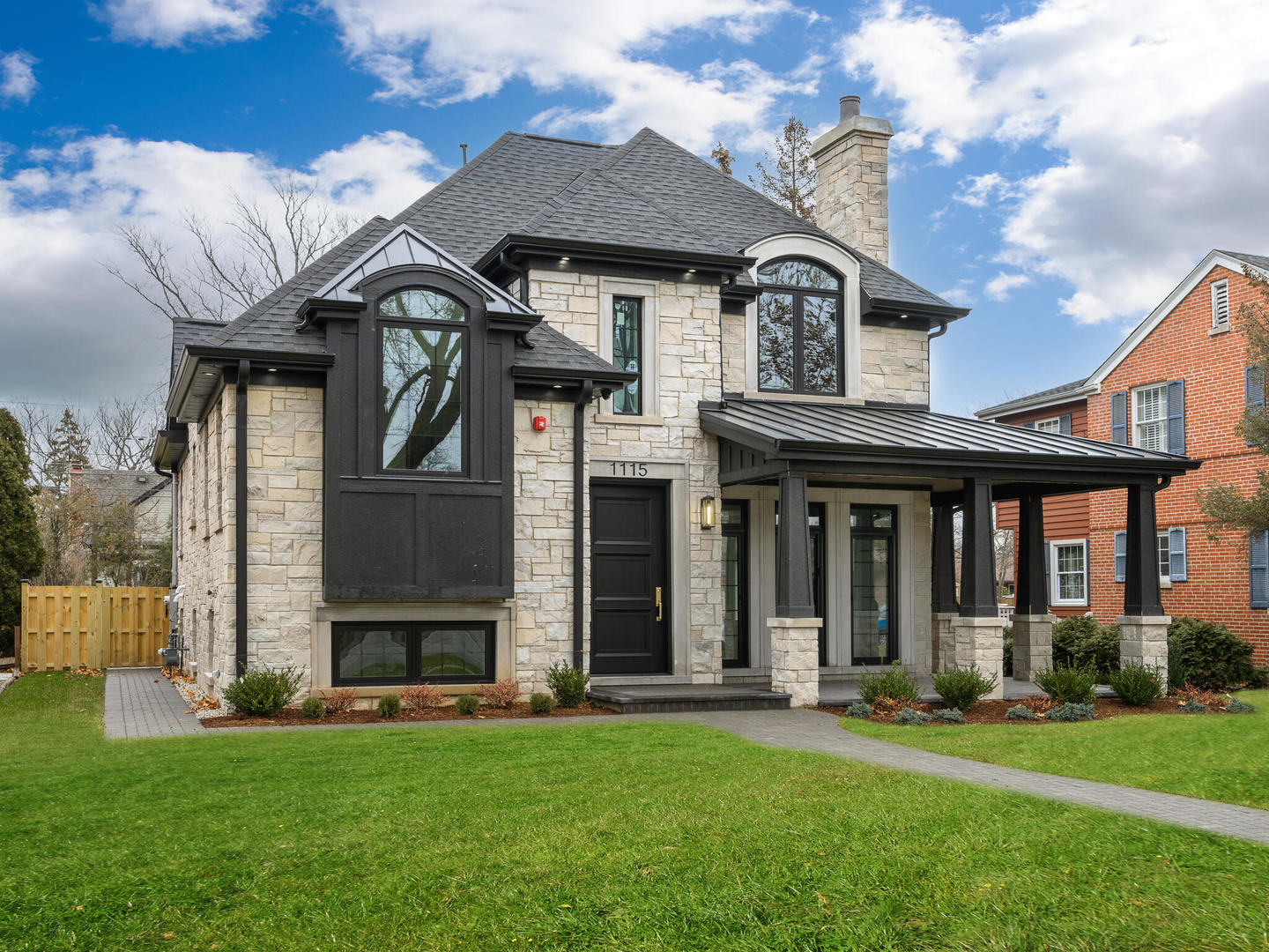 1115 South Delphia Avenue Park Ridge, IL 60068 - Photo 2 of 38 a view of a white house with a large windows and a yard with plants and large trees