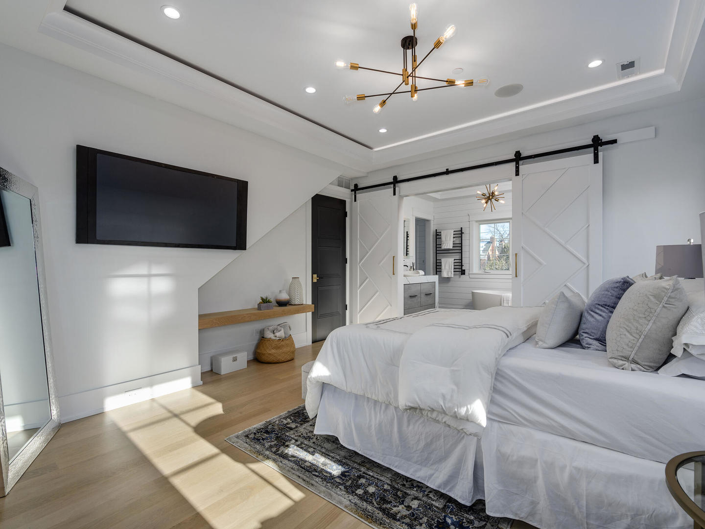 1115 South Delphia Avenue Park Ridge, IL 60068 - Photo 23 of 38 a spacious bedroom with a large bed and a flat screen tv