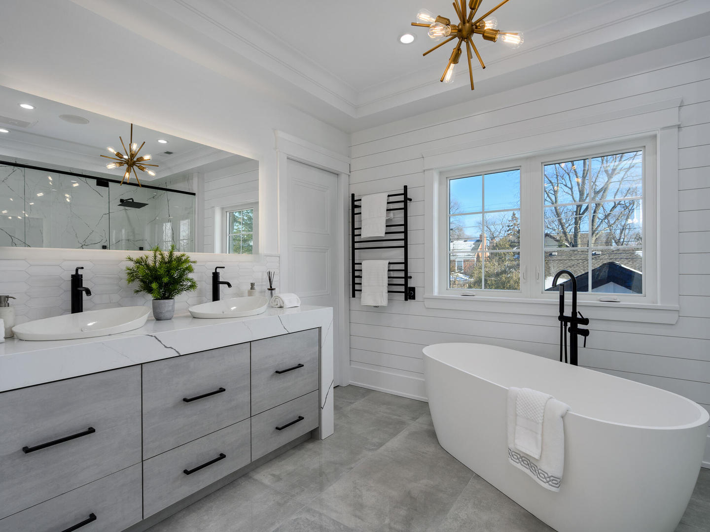 1115 South Delphia Avenue Park Ridge, IL 60068 - Photo 25 of 38 a spacious bathroom with a double vanity sink a mirror a bathtub and window