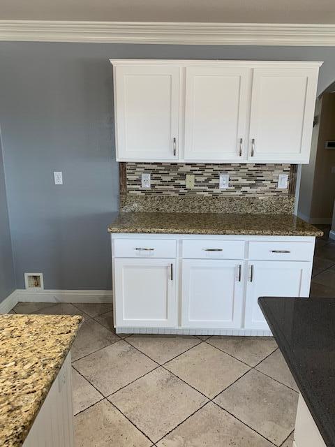 6148 Cecina Place Palmdale, CA 93552 - Photo 20 of 66 a utility room with granite countertop cabinets and sink