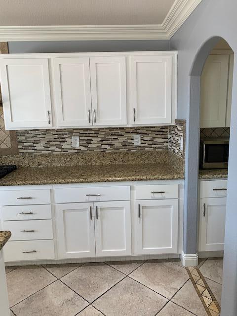 6148 Cecina Place Palmdale, CA 93552 - Photo 25 of 66 a view of kitchen with granite countertop cabinets