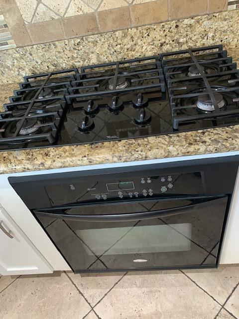 6148 Cecina Place Palmdale, CA 93552 - Photo 26 of 66 a close view of a stove