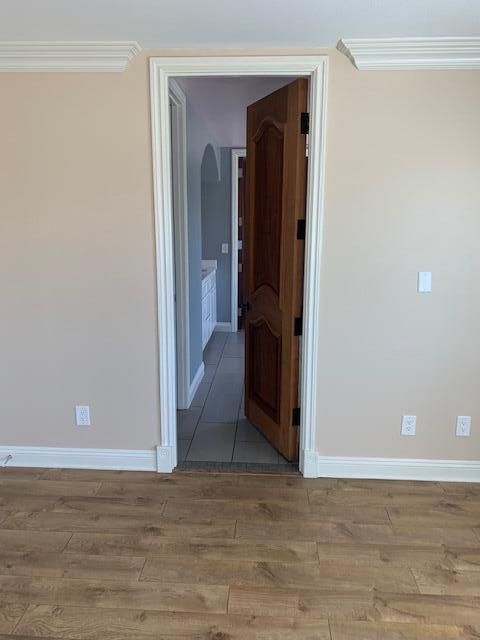 6148 Cecina Place Palmdale, CA 93552 - Photo 41 of 66 a view of a hallway with wooden floor and closet