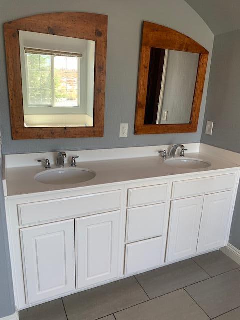 6148 Cecina Place Palmdale, CA 93552 - Photo 45 of 66 a bathroom with a sink and a mirror