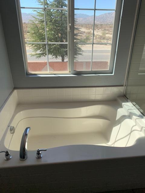6148 Cecina Place Palmdale, CA 93552 - Photo 46 of 66 a bathroom with a sink and a window