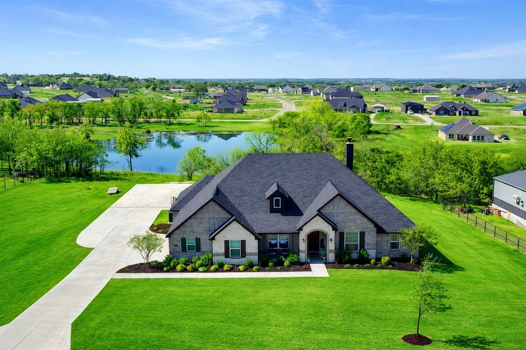 1037 Boulder Road Weatherford, TX 76085 - Photo 1 of 24 a front view of a house with garden
