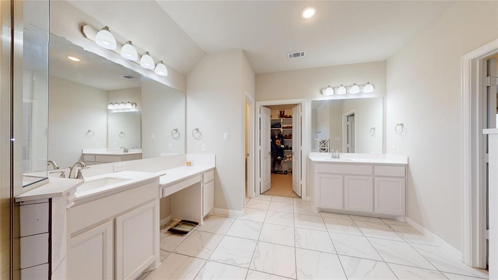 1037 Boulder Road Weatherford, TX 76085 - Photo 17 of 24 a spacious bathroom with a granite countertop sink mirror and
