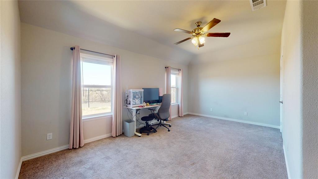 1037 Boulder Road Weatherford, TX 76085 - Photo 19 of 24 a view of a workspace with furniture and a window
