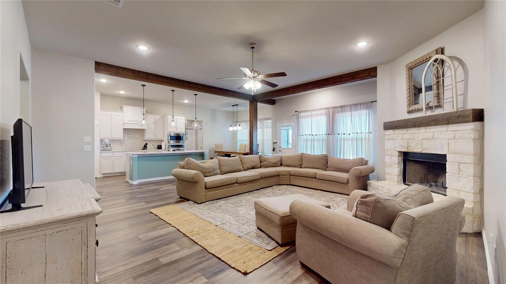 1037 Boulder Road Weatherford, TX 76085 - Photo 7 of 24 a living room with furniture and a fireplace