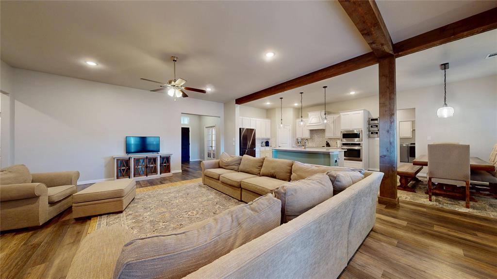 1037 Boulder Road Weatherford, TX 76085 - Photo 9 of 24 a living room with furniture and a large window