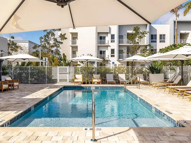 a view of a swimming pool with a lounge chairs