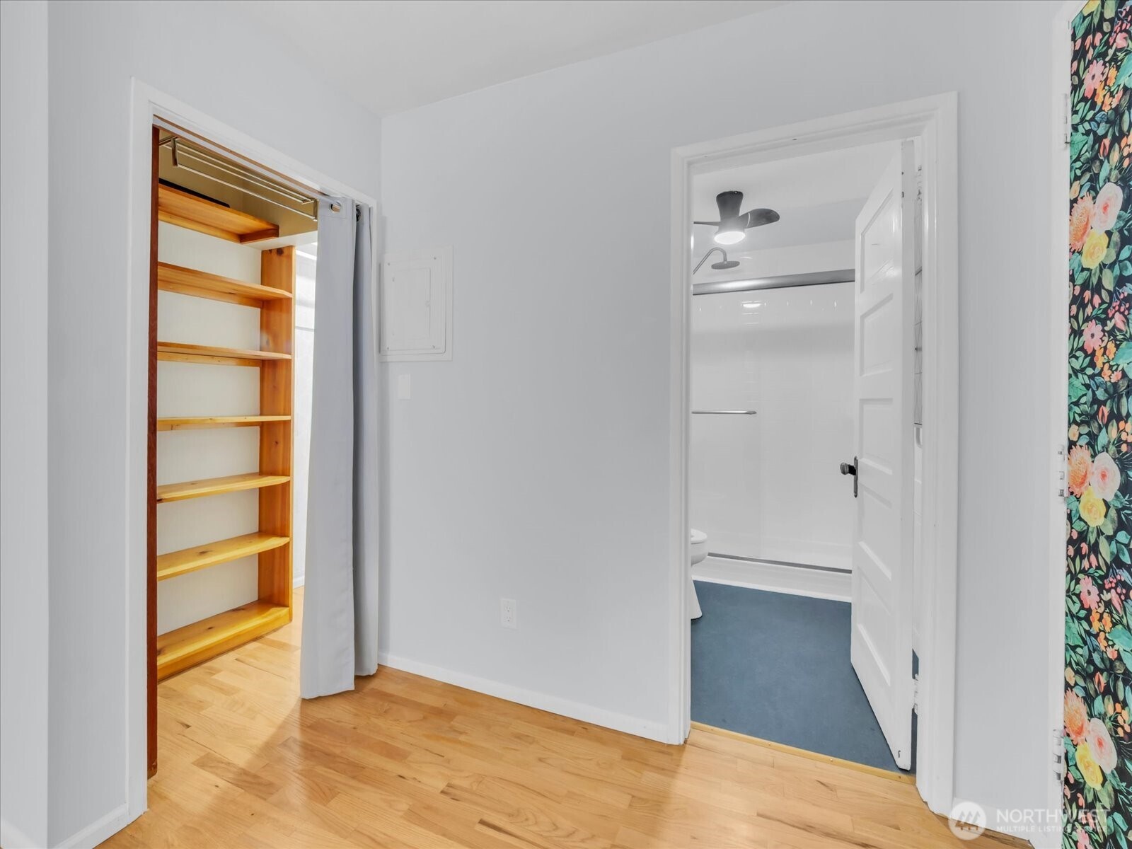 7 Harrison Street, Unit 17 Seattle, WA 98109 - Photo 11 of 20 a view of an empty room with closet and wooden floor