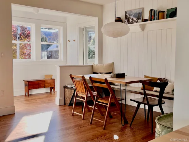 a dining room with furniture and window