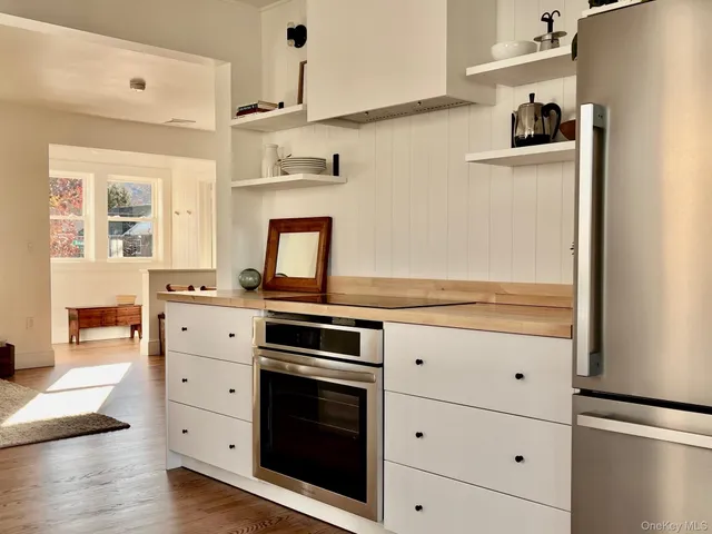 a kitchen with a stove and a refrigerator