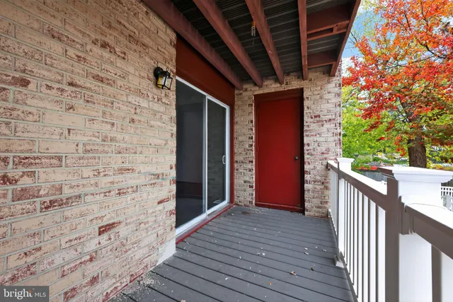 a view of a balcony with wooden floor