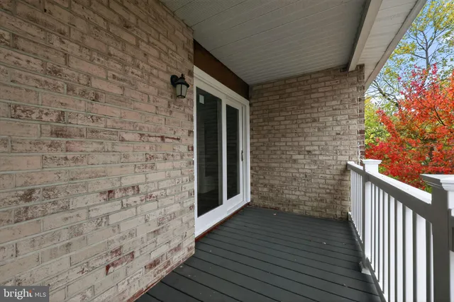 a view of a wooden door and wooden floor