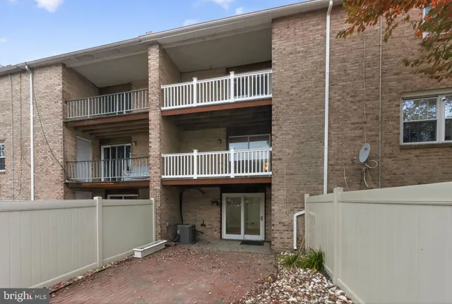 a building with glass windows and a table