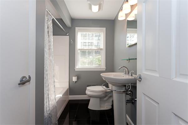 231 Ridge Street Arlington, MA 02474 - Photo 11 of 22 a bathroom with a sink toilet and a window