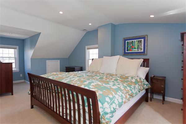 231 Ridge Street Arlington, MA 02474 - Photo 12 of 22 a bedroom with a bed and a table
