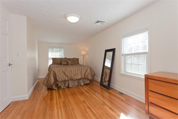 231 Ridge Street Arlington, MA 02474 - Photo 17 of 22 a bedroom with a bed and a window