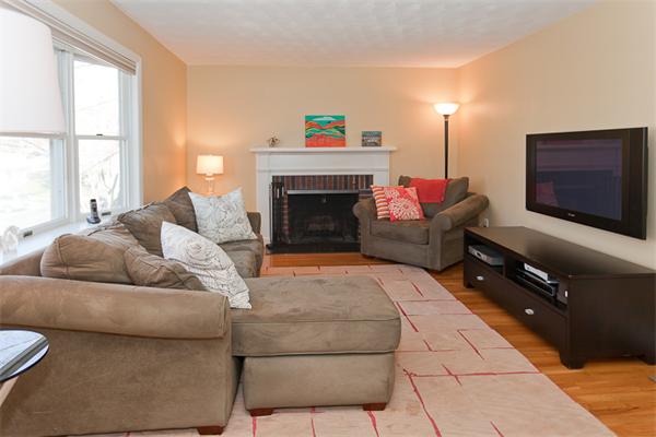 231 Ridge Street Arlington, MA 02474 - Photo 2 of 22 a living room with furniture and a fireplace