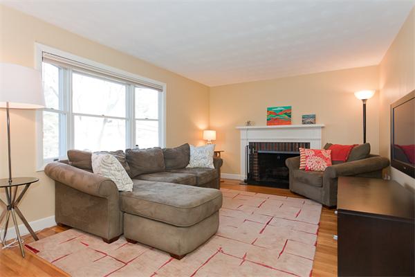 231 Ridge Street Arlington, MA 02474 - Photo 3 of 22 a living room with furniture and a fireplace