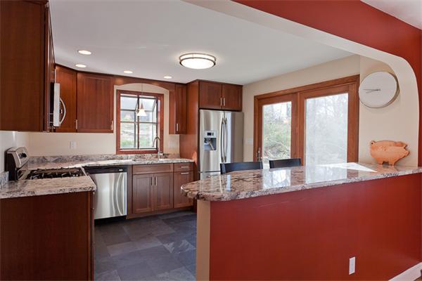 231 Ridge Street Arlington, MA 02474 - Photo 7 of 22 a kitchen with granite countertop a sink stove and refrigerator