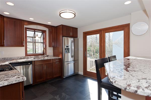 231 Ridge Street Arlington, MA 02474 - Photo 9 of 22 a view of kitchen with stainless steel appliances granite countertop sink stove refrigerator and wooden floor