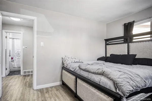 a bedroom with a bed and a walk in closet