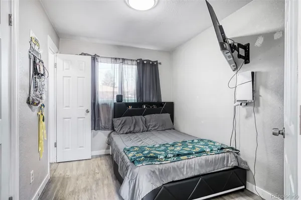 a bedroom with a large bed and a window