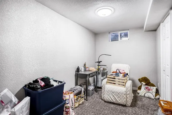 a bedroom with bed and a window