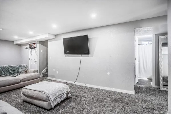 a living room with a couch and a flat screen tv