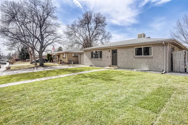 a house view with swimming pool in front of it