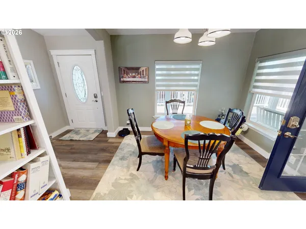 a dining room with furniture and window