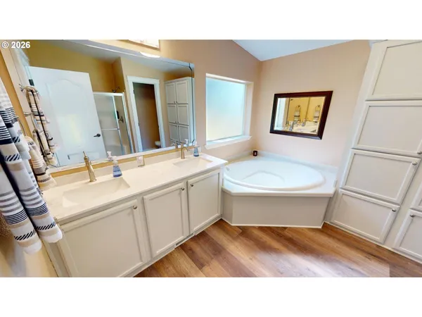 a bathroom with a sink toilet a mirror and vanity
