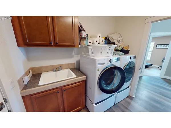 a bathroom with a sink a washer and dryer