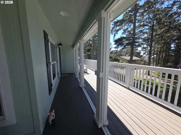 a view of balcony with wooden floor