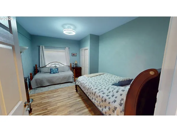 a living room with furniture and a mirror