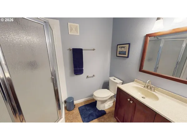 a bathroom with a sink toilet and a mirror