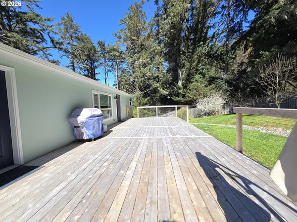 a view of a wooden deck with a bench