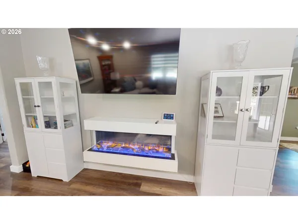 a black and white photo of a living room with a fireplace