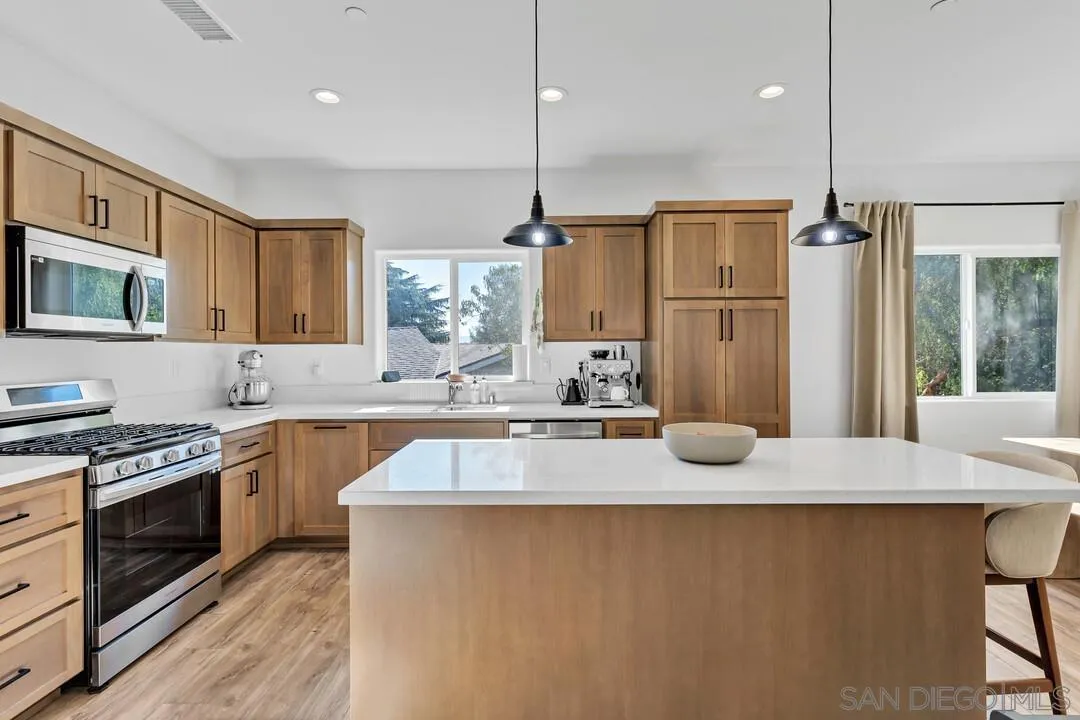 130 Scenic Drive El Cajon, CA 92021 - Photo 1 of 50 a kitchen with stainless steel appliances granite countertop a sink a stove and a refrigerator