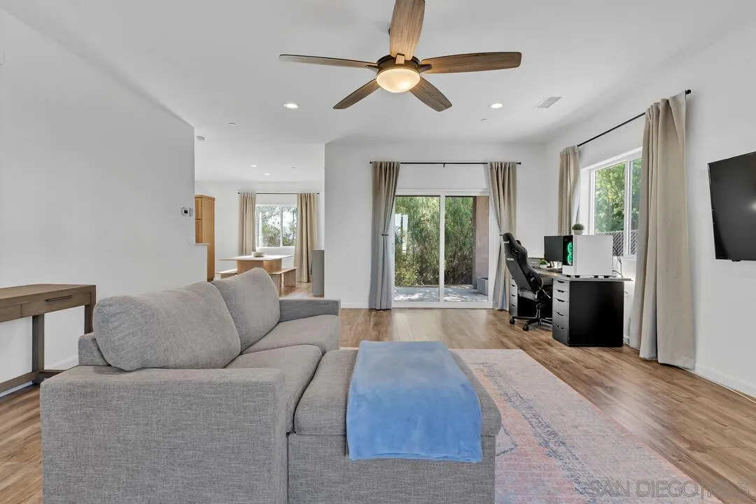 130 Scenic Drive El Cajon, CA 92021 - Photo 14 of 50 a living room with furniture fireplace and flat screen tv