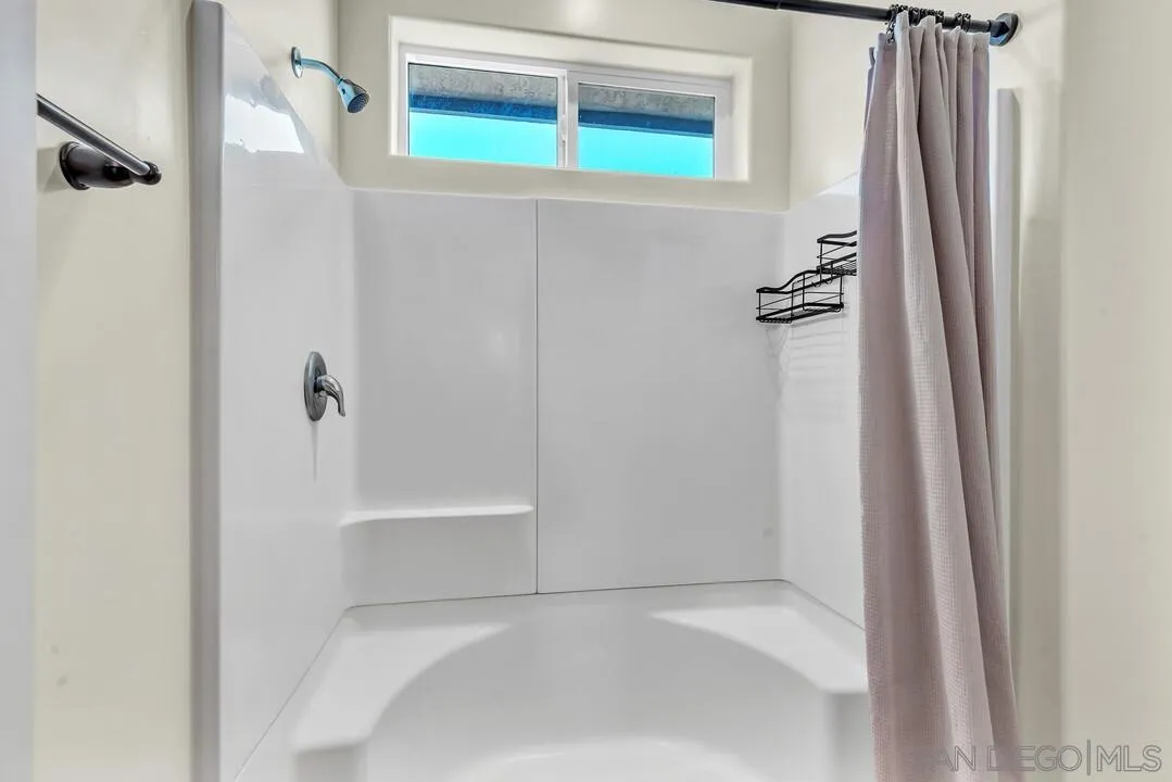 130 Scenic Drive El Cajon, CA 92021 - Photo 24 of 50 a bathroom with a bathtub and shower