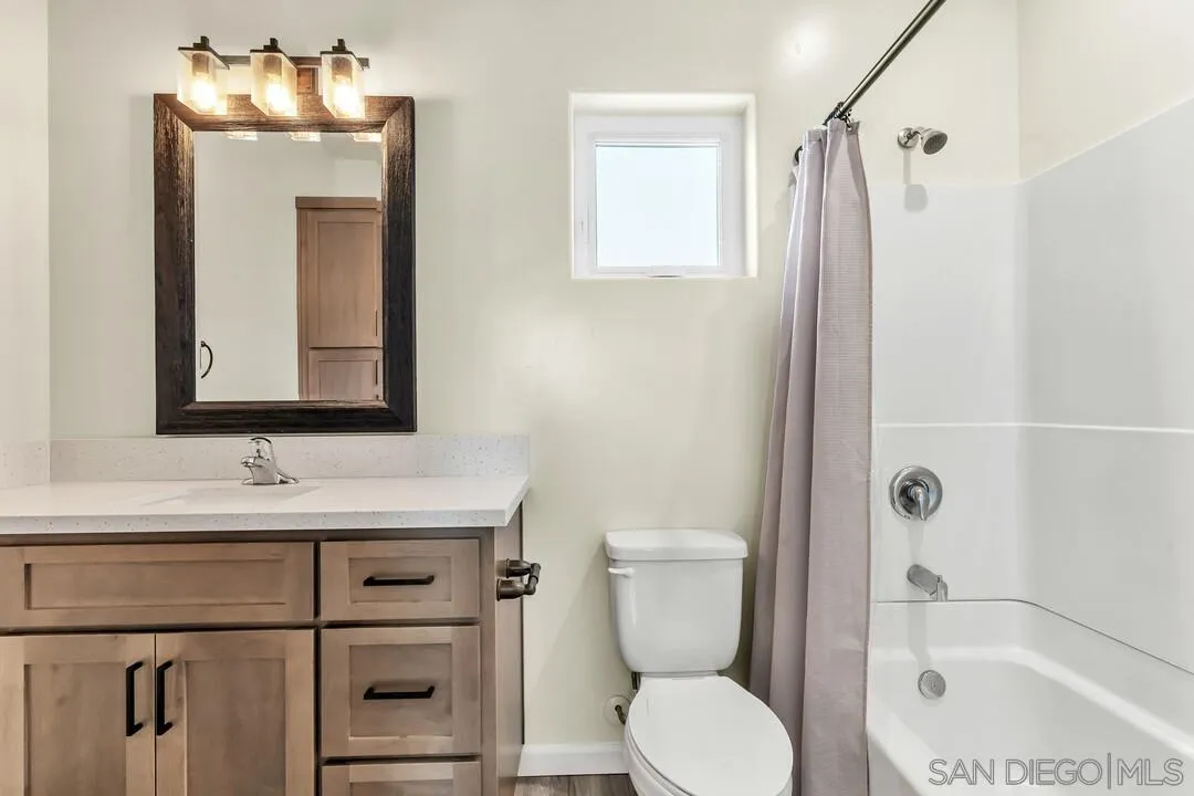 130 Scenic Drive El Cajon, CA 92021 - Photo 30 of 50 a bathroom with a sink toilet and shower