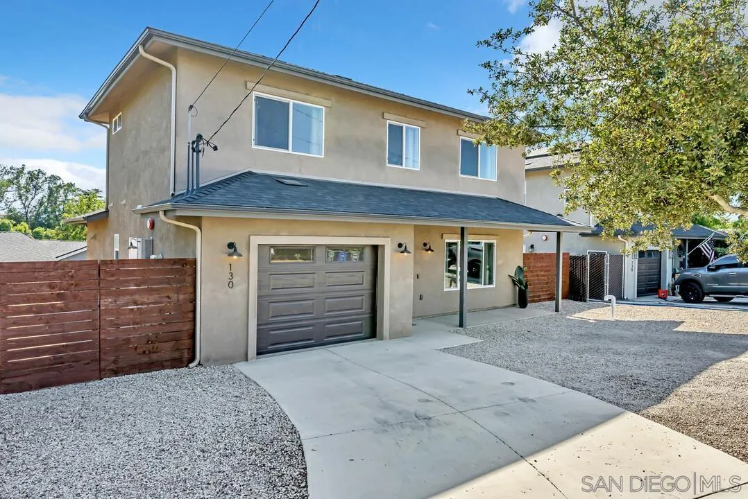 130 Scenic Drive El Cajon, CA 92021 - Photo 3 of 50 a front view of a house with a garage