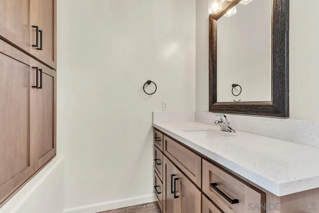 130 Scenic Drive El Cajon, CA 92021 - Photo 31 of 50 a bathroom with a sink and a mirror