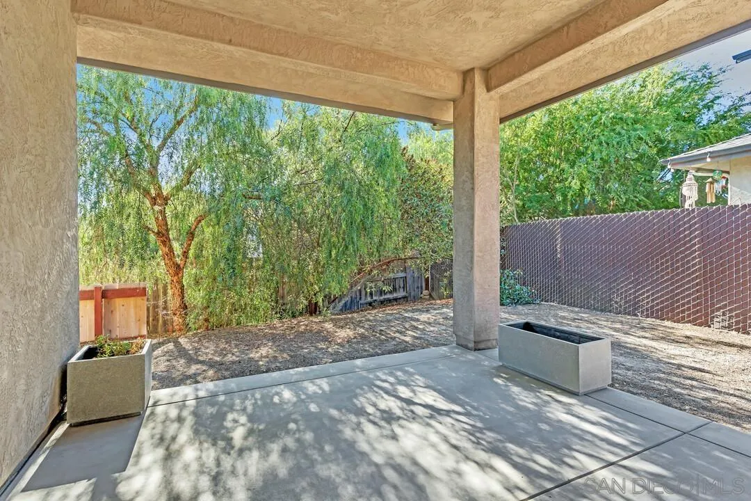 130 Scenic Drive El Cajon, CA 92021 - Photo 33 of 50 a wooden bench sitting in front of a building