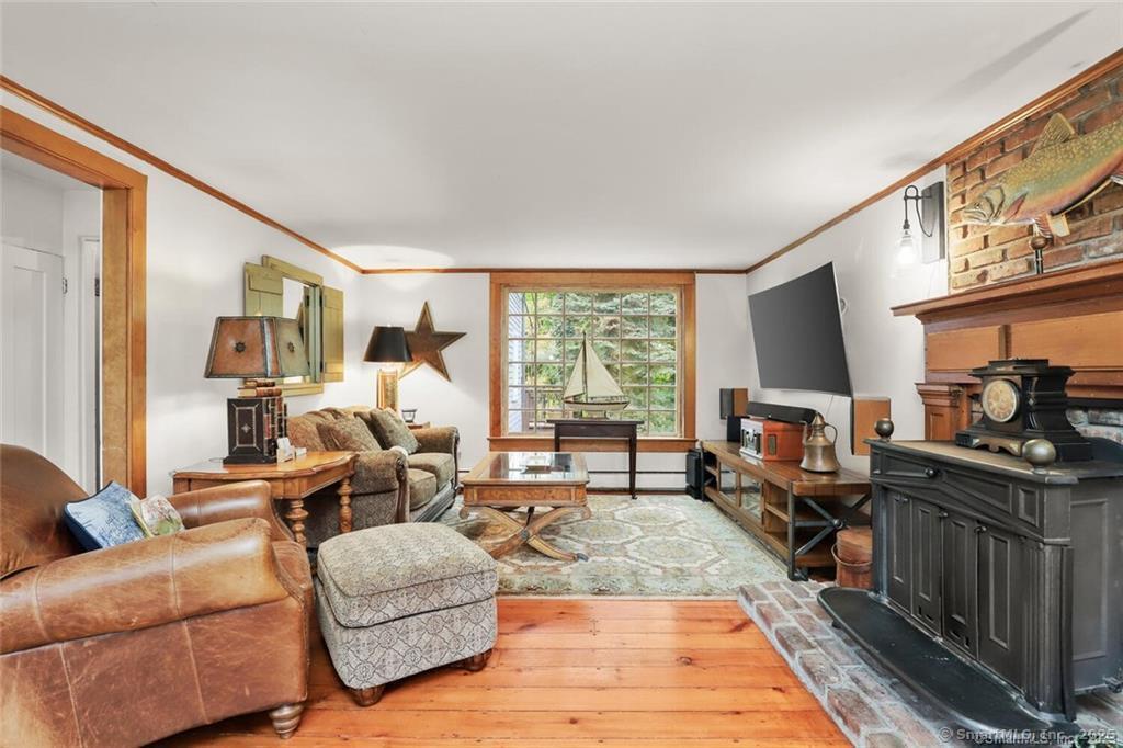 47 Hollow Tree Ridge Road, Unit A Darien, CT 06820 - Photo 1 of 33 Liviing Room with Wood Stove
